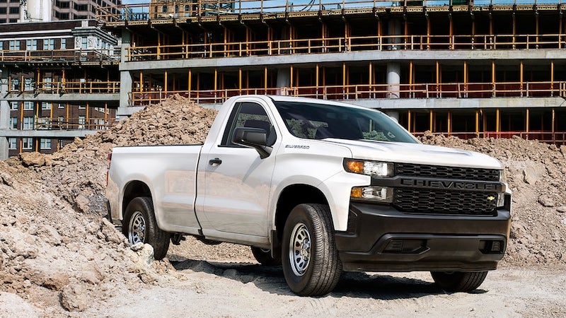 white Chevrolet Silverado 1500 near construction site