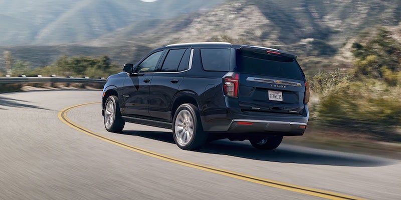 back view of blue Chevy Tahoe